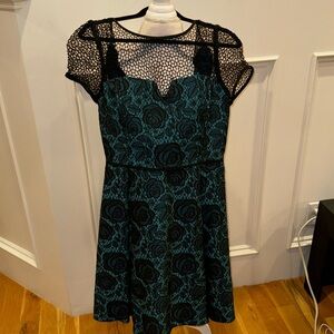 Turquoise and black texturized dress with a knit top and shoulders